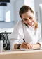 Woman taking notes on customs requirements 